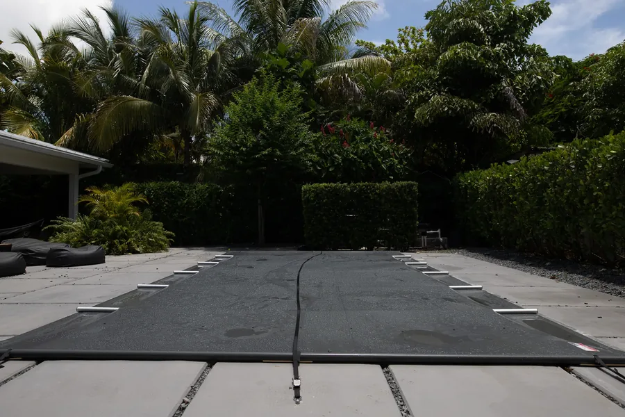 B-COVER manual safety pool cover installed on a Miami pool