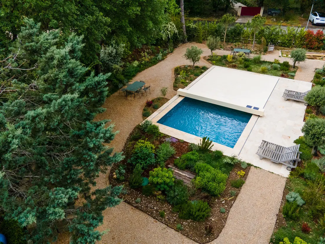 Aerial view of a garden pool with a retractable enclosure